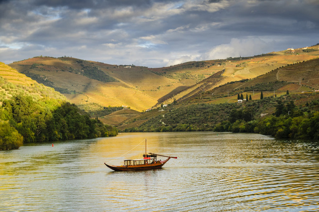 main_TSY__A_traditional_Portuguese_rabelo_boat_cruising_down_the_Duoro_River_Portugal.jpg